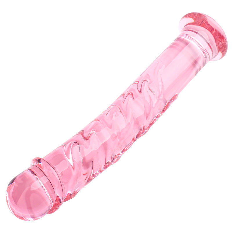 Pink glasdildo 19 cm med bølget design og feminin pink farve, lavet af holdbart glas for sikker og intens stimulation.