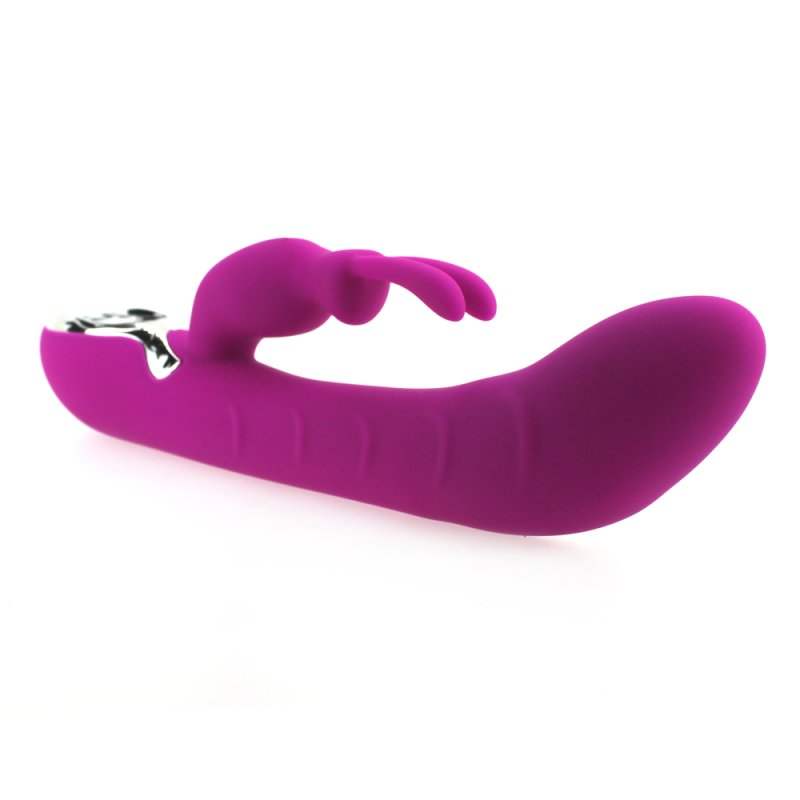 Opvarmende lilla silikone G-punkt rabbit vibrator med ergonomisk design og blød overflade.