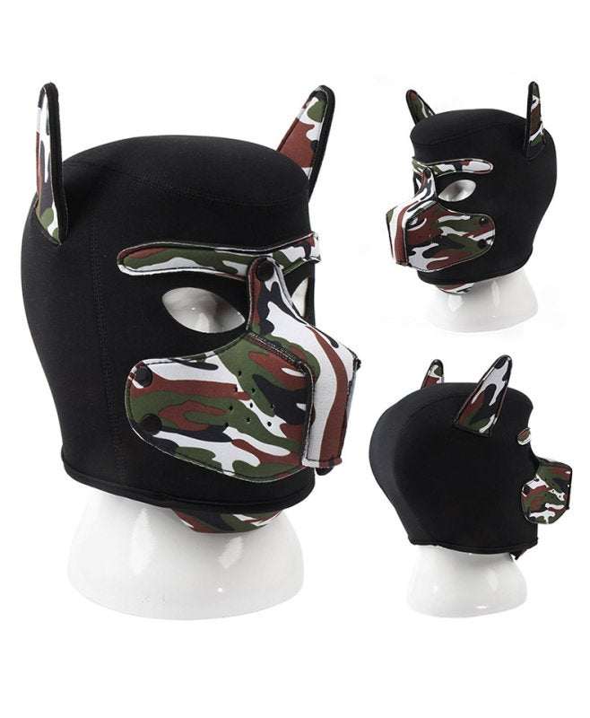 Camouflage dog bondage hood made of faux leather with ear and muzzle details, lightweight and one size fits most dogs.