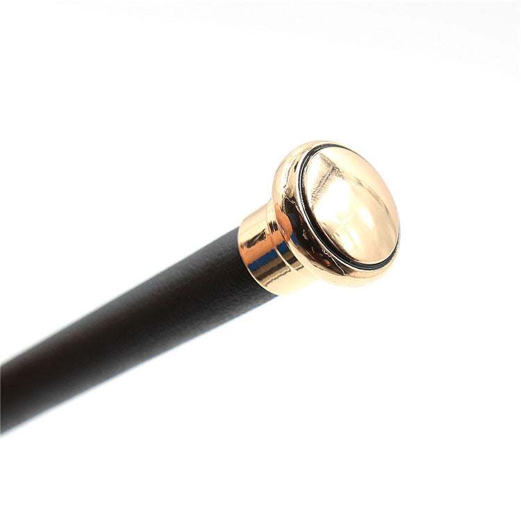 Flirt Leather Riding Crop i sort syntetisk læder med gyldne detaljer og let design på 61 cm.