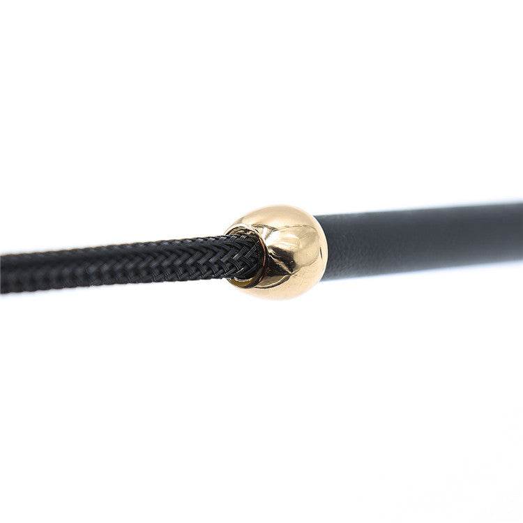 Flirt Leather Riding Crop i sort syntetisk læder med gyldne detaljer og eksklusivt design