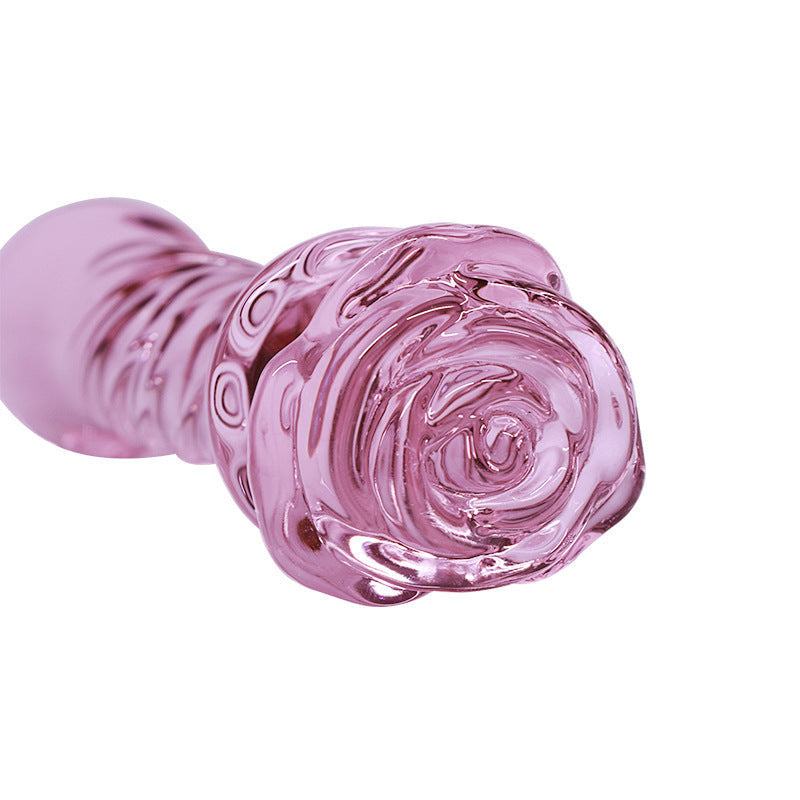 Pink glas butt plug med blomsterdesign, elegant og glat til nydelse.